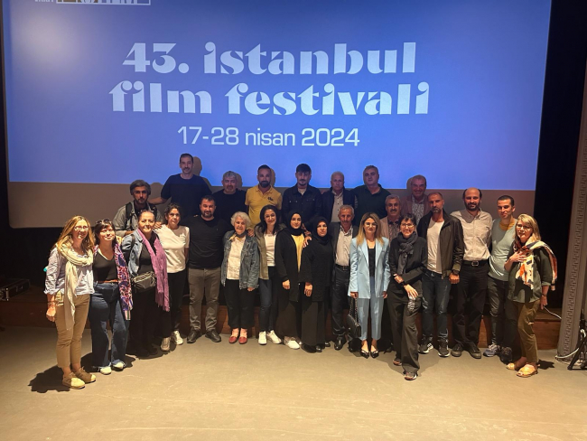 Film crew, relatives of the disappeared, and Saturday Mothers pose for a group photo after the screening on Saturday, April 27, which took place at the Beyoğlu Cinema.